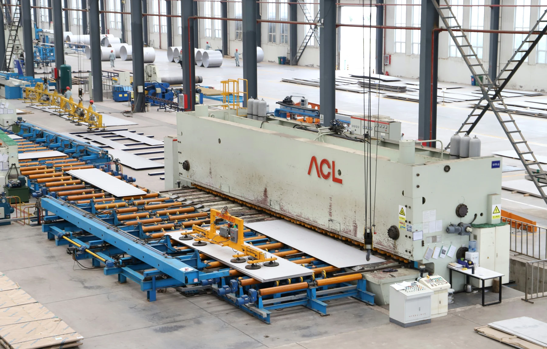 Wide view of a modern manufacturing facility and production machinery